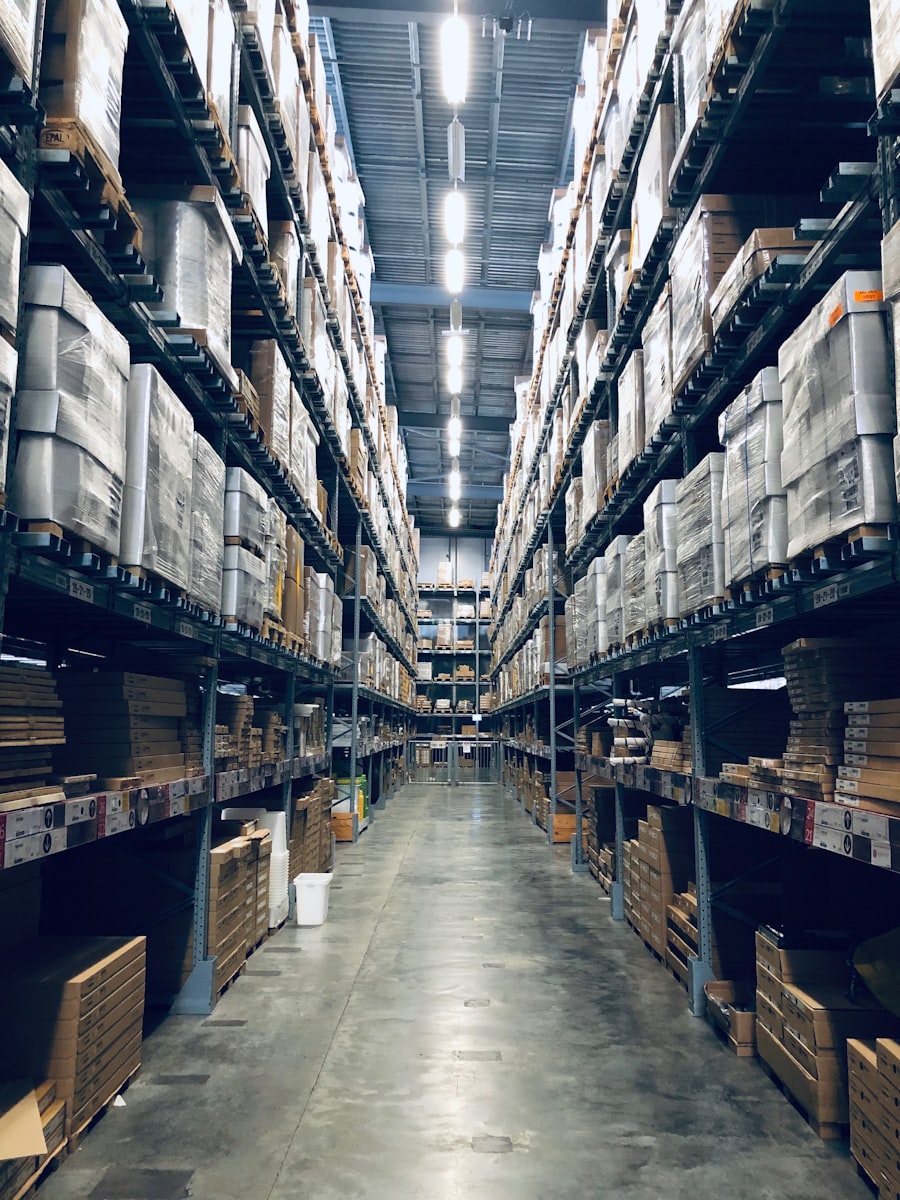 Warehouse aisle stacked with palletised goods ready for distribution